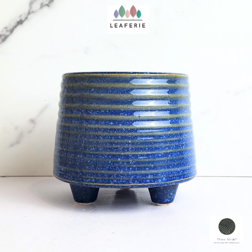 The Leaferie Viola blue ceramic pot with leg