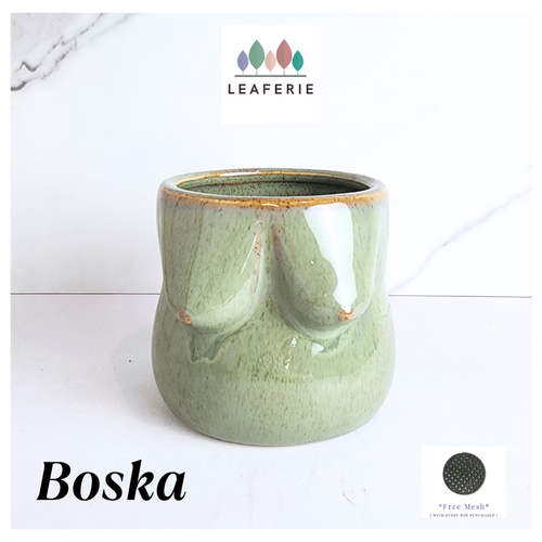 Green ceramic planter with 'Leaferie' branding on a white background