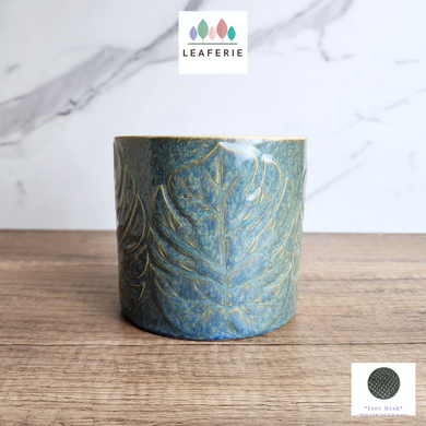 The Leaferie Aspasia blue leaf motif pot. ceramic material