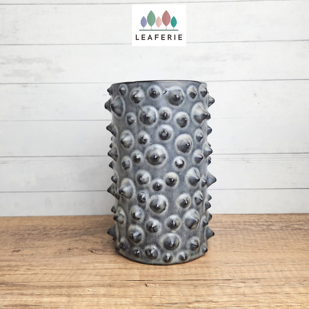 The Leaferie Nhu Tall grey flowerpot with spikes. ceramic material