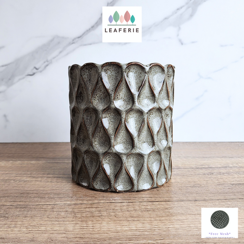 The Leaferie Rania tall grey pot. ceramic material