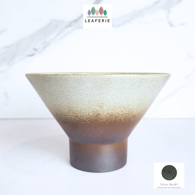 Ceramic planter with gradient design on a white background, featuring the Leaferie brand.