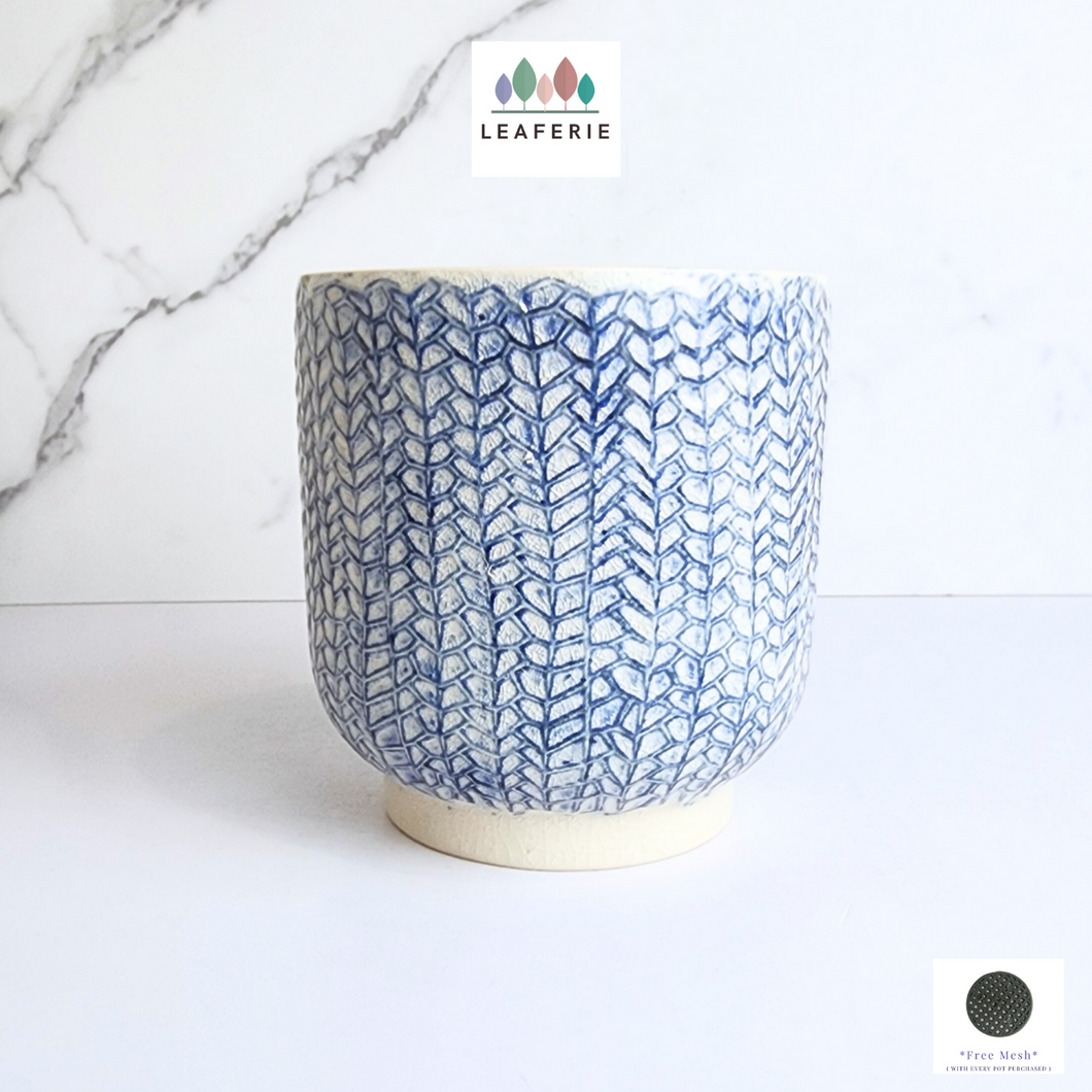 The Leaferie Cora blueish flowerpot. ceramic material