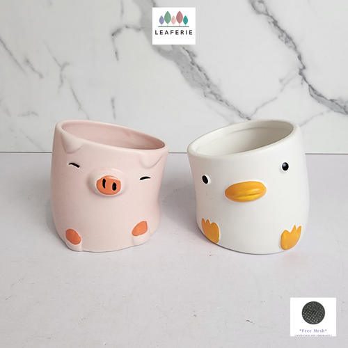 The Leaferie Odell flowerpot . 2 designs pink and white ceramic pot.