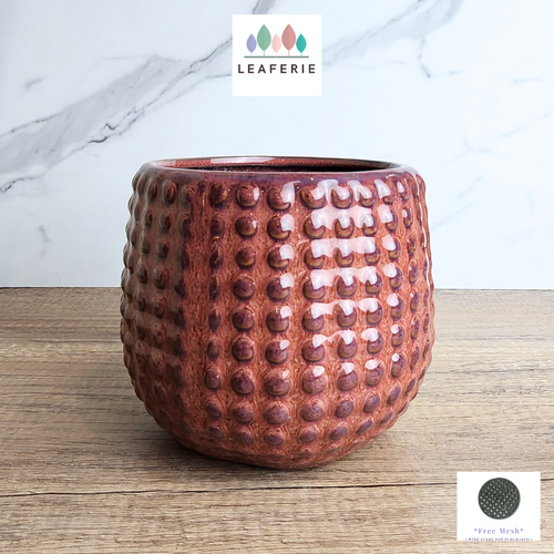 THe Leaferie Marika red studded flowerpot. ceramic material