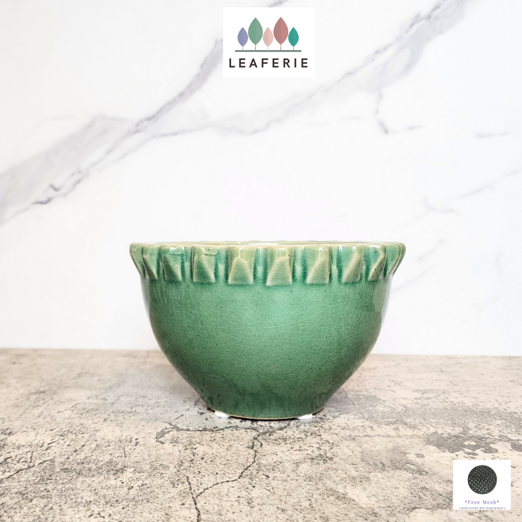 The Leaferie Tadao wide shallow pot. green colour and ceramic material