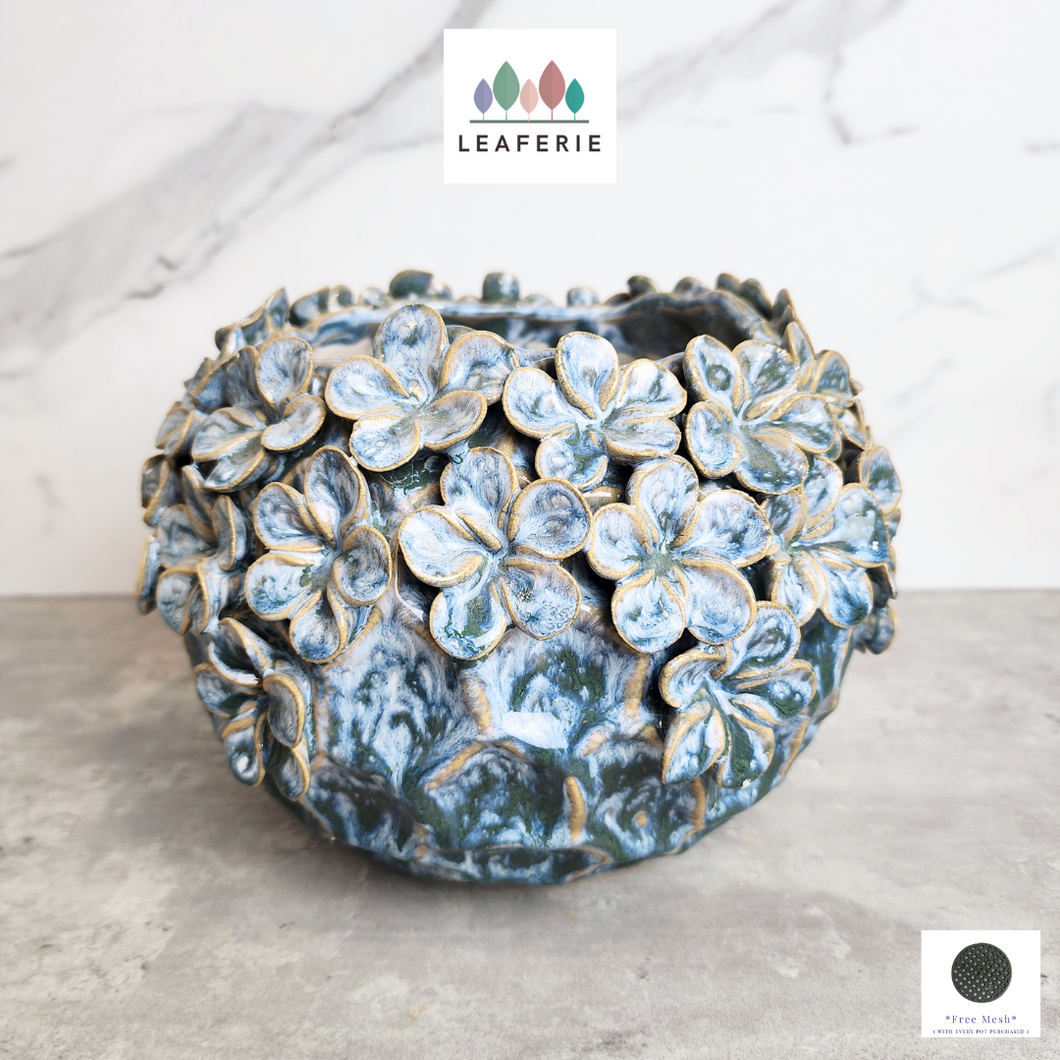 The Leaferie Ariel blue flower petal pot. ceramic material