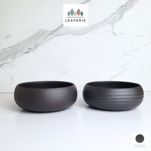 The Leaferie Lilou shallow pot. 2 designs black ceramic pot.