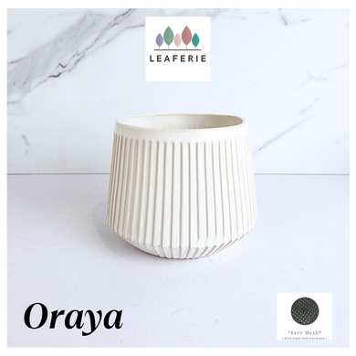 Oraya Leaferie White ribbed planter on a light gray background with Leaferie branding.