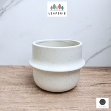 Load image into Gallery viewer, The Leaferie Tane white ceramic pot. 
