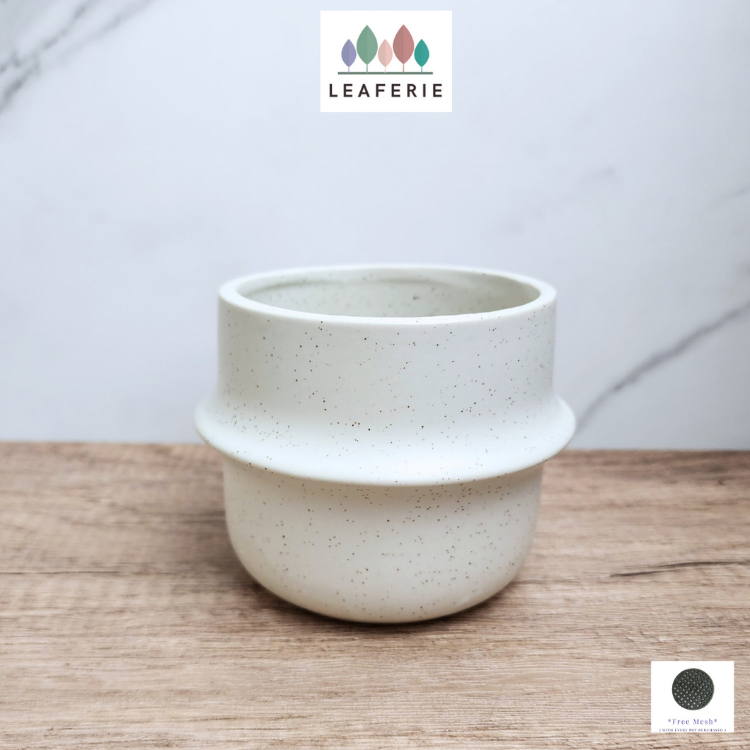 The Leaferie Tane white ceramic pot. 