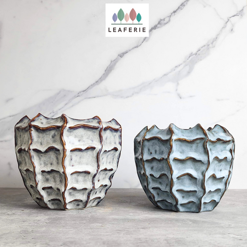 The Leaferie Jin FLowerpot. 2 designs grey and blue. ceramic material