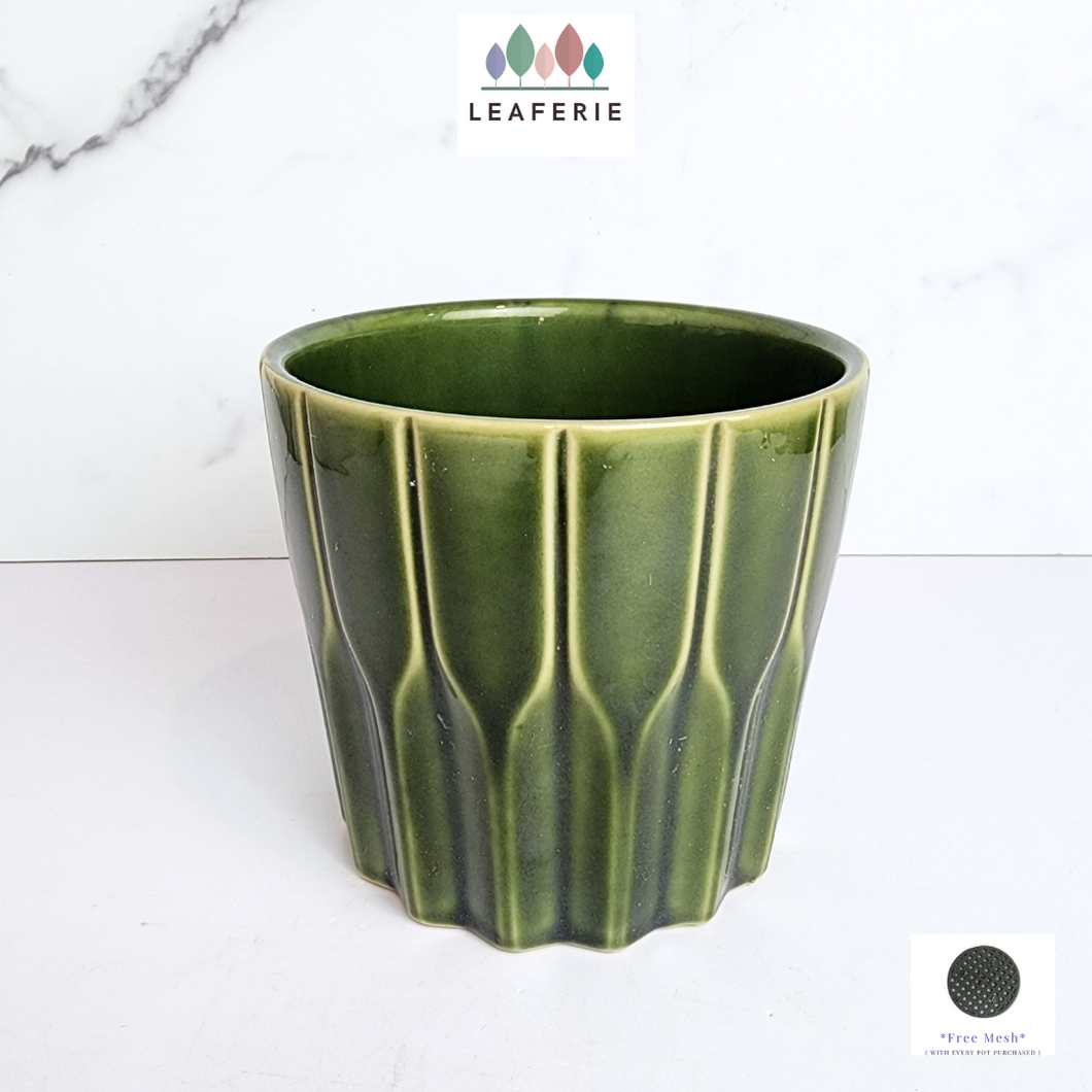 The Leaferie edda green ceramic pot.