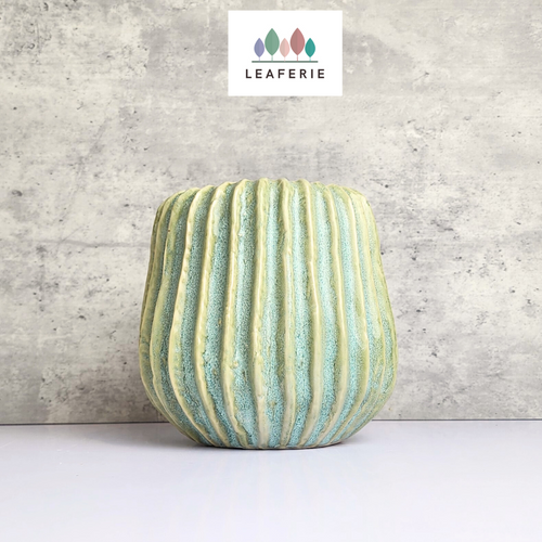 The Leaferie Gotilda green plant pot. ceramic planter. front view
