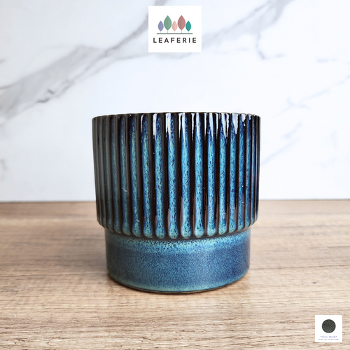 The Leaferie Varda Blue ceramic pot. 