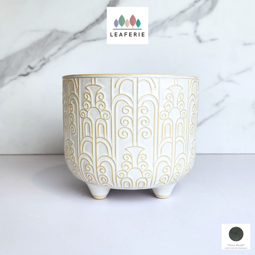The Leaferie Loki white flowerpot with stand. ceramic material
