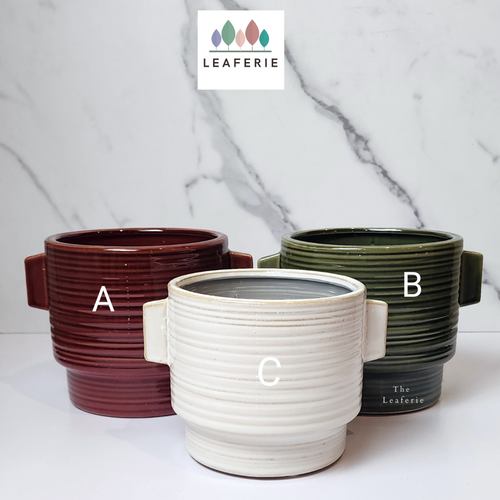 The Leaferie Aizen plant pot. 3 colours, red , green and white. ceramic pots. front view of 3 colours