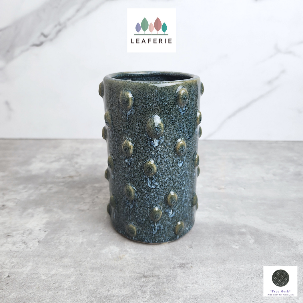 The Leaferie Malia Tall flowerpot. blue colour with bumps. ceramic material