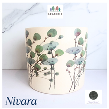Load image into Gallery viewer, Decorative pot with floral design on a white background, featuring the brand &#39;LEAFERIE&#39;.
