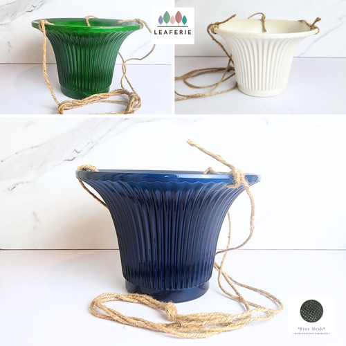 The Leaferie Lyon hanging flowerpot . 3 colours blue, green and white and 2 sizes . Ceramic material