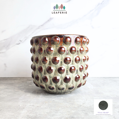Twilla Ceramic pot with textured surface on a light background, featuring the Leaferie brand.