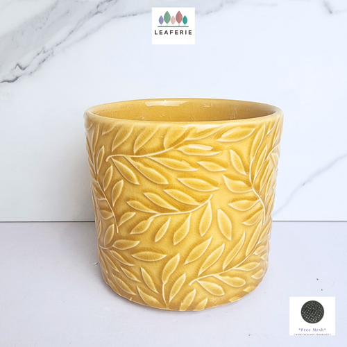 The Leaferie Mackenzie yellow flowerpot. ceramic material