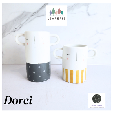 Dorei Two pots with polka dot and striped design on a marble background, featuring the LEAFERIE brand.