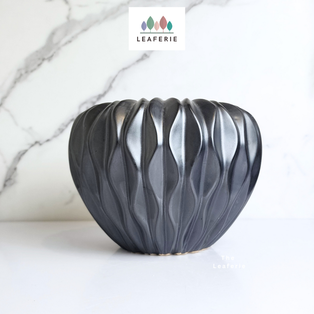 The Leaferie Ebony plant pot. black ceramic planter. front view