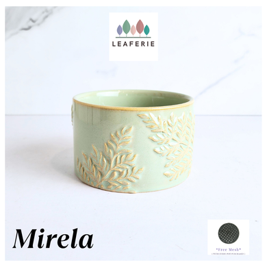 Mirela Decorative ceramic pot with leaf patterns on a white background, featuring the brand 'LEAFERIE'.