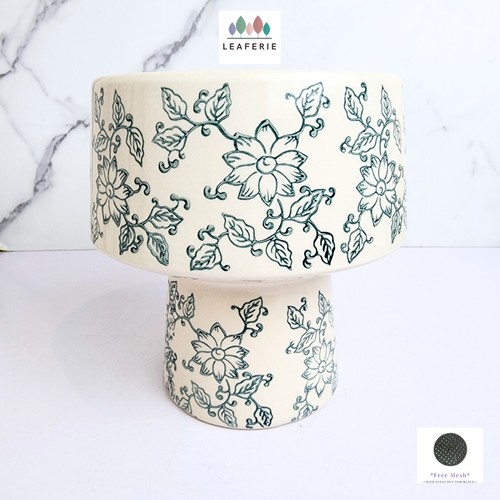 The Leaferie Tori floral white and blue flowerpot. ceramic material