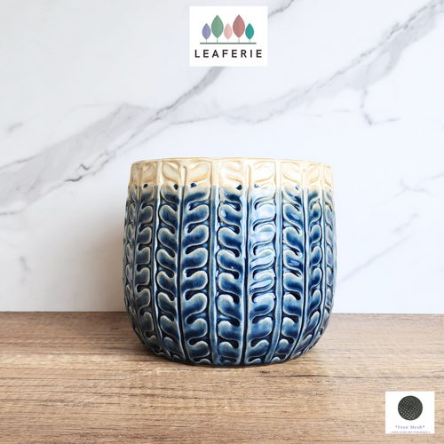 The Leaferie Aretie Blue and white ceramic pot. Leaf motif