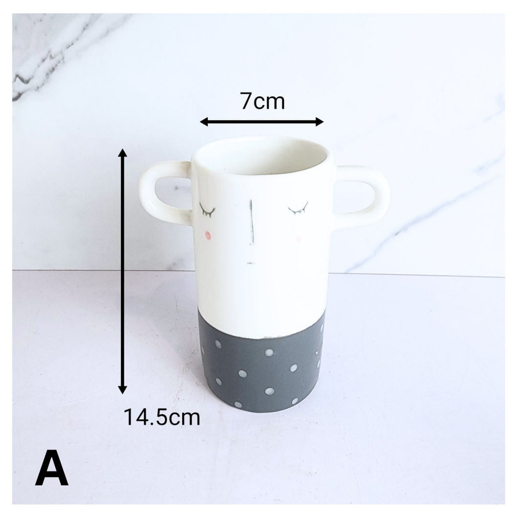 Dorei Two pots with polka dot and striped design on a marble background, featuring the LEAFERIE brand.