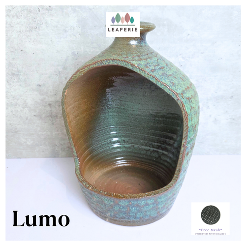 Lumo Ceramic vase with textured surface and 'LEAFERIE' branding on a light gray background