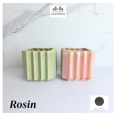 Rosin square ceramic planters with striped design on a marble surface, featuring the brand 'LEAFERIE'.