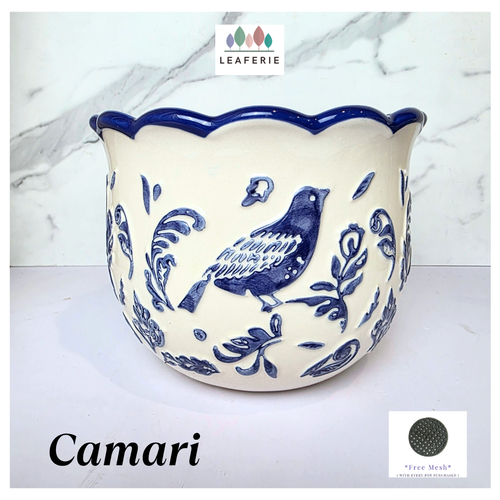 Camari Ceramic planter with blue bird and floral patterns on a white background, featuring the brand 'LEAFERIE'.