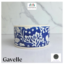 Load image into Gallery viewer, A ceramic bowl by Gavelle from the brand LEAERIE, featuring a deep cobalt blue and white floral pattern, set against a light marble background.
