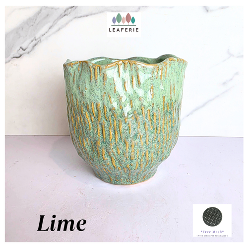 Lime Green ceramic vase with gold accents on a white background, featuring the Leaferie brand.