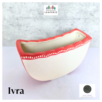 Ivra hangiing Ceramic planter with red rim and white interior on a light gray background, featuring the brand 'LEAFERIE'.
