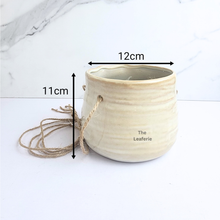 Load image into Gallery viewer, The Leaferie Lyon hanging planter series 17. Ceramic material and beige colour
