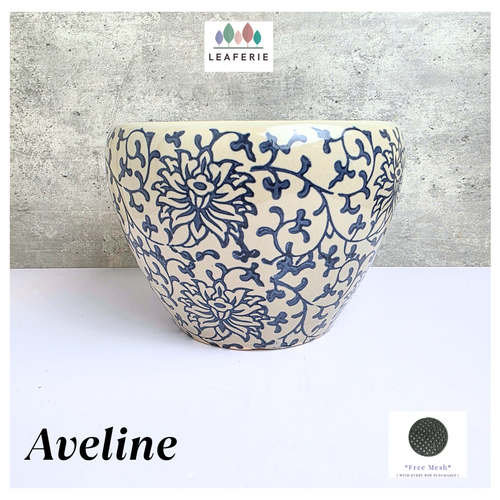 Aveline Ceramic planter with blue floral pattern on a gray background, featuring the Leaferie brand.