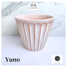 Load image into Gallery viewer, Yuno terracotta planter with ribbed design on a marble background, featuring the brand 'LEAFERIE'.
