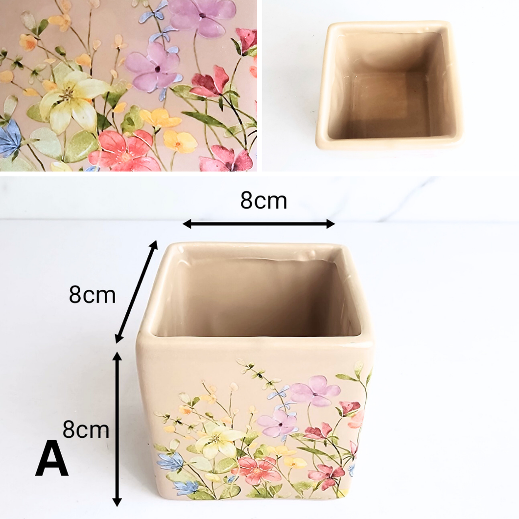 Square ceramic planter with floral design and measurements on a white background