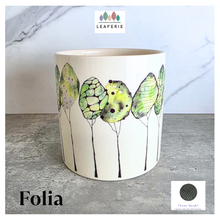 Load image into Gallery viewer, Folia Ceramic planter with butterfly design on a gray surface, featuring the brand 'LEAFAERIE'.
