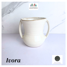 Load image into Gallery viewer, Ivora White ceramic mug with handles on a light gray background, featuring the LEAFERIE brand.
