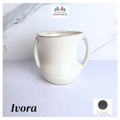 Ivora White ceramic mug with handles on a light gray background, featuring the LEAFERIE brand.