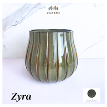 Load image into Gallery viewer, Zyra Green ceramic vase with striped pattern on a white background, featuring the brand &#39;LEAFERIE&#39;.
