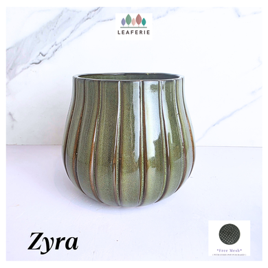 Zyra Green ceramic vase with striped pattern on a white background, featuring the brand 'LEAFERIE'.