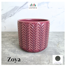 Load image into Gallery viewer, Zoya Pink ceramic pot with leaf pattern on a gray surface, branded 'LEAFERIE'.
