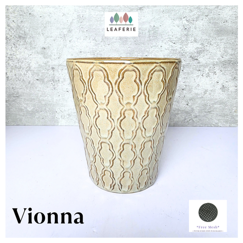 Vionna Beige ceramic pot with decorative patterns on a white surface, branded 'LEAFERIE'.