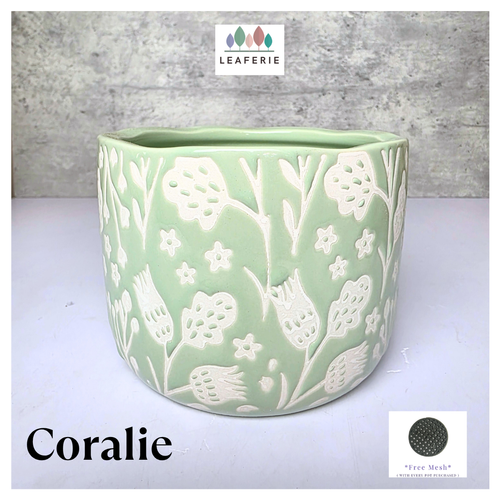 Coralie Green ceramic planter with white floral patterns on a gray background, featuring the brand 'LEAFERIE'.